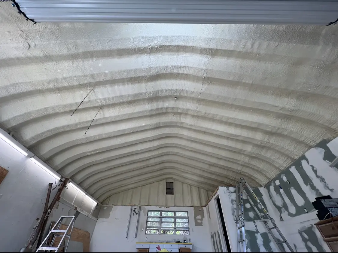 Spray polyurethane foam applied to the underside of a metal roof deck in Tequesta